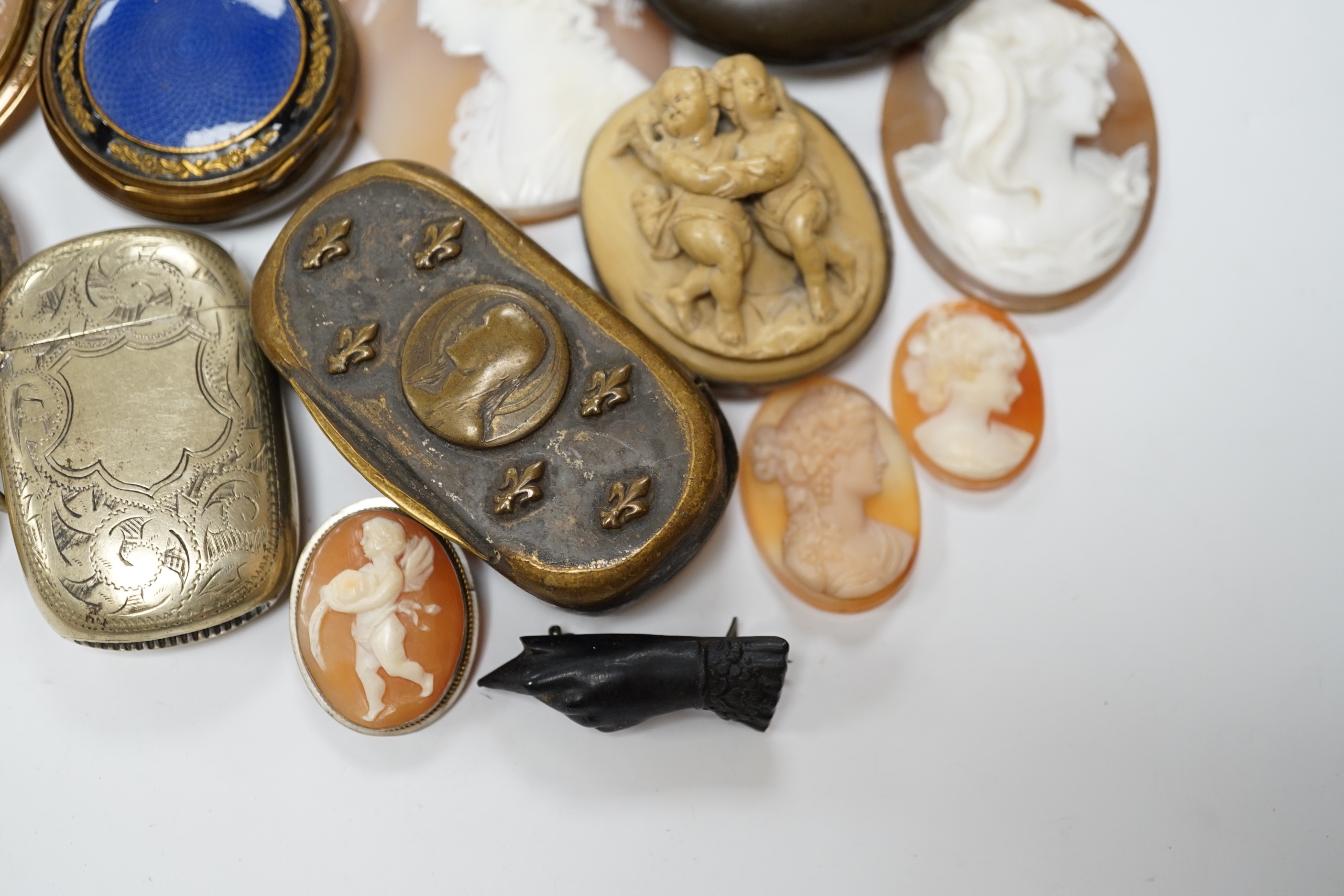 Five assorted unmounted carved cameo shells, largest 57mm, four other mounted cameo brooches including three shell, two base metal vestas and a box and sundry other items.